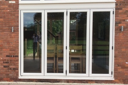 Cream Woodgrain PVCu Bi-folding Door, 